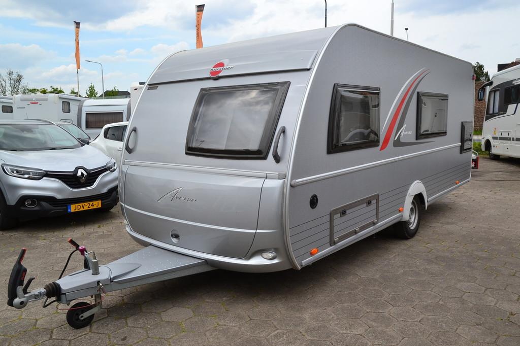 Burstner Averso 495 TK - Stapelbed - Fransbed - Voortent - 6, Caravans en Kamperen, Kachel, Overige typen, 7 tot 8 meter, Bedrijf