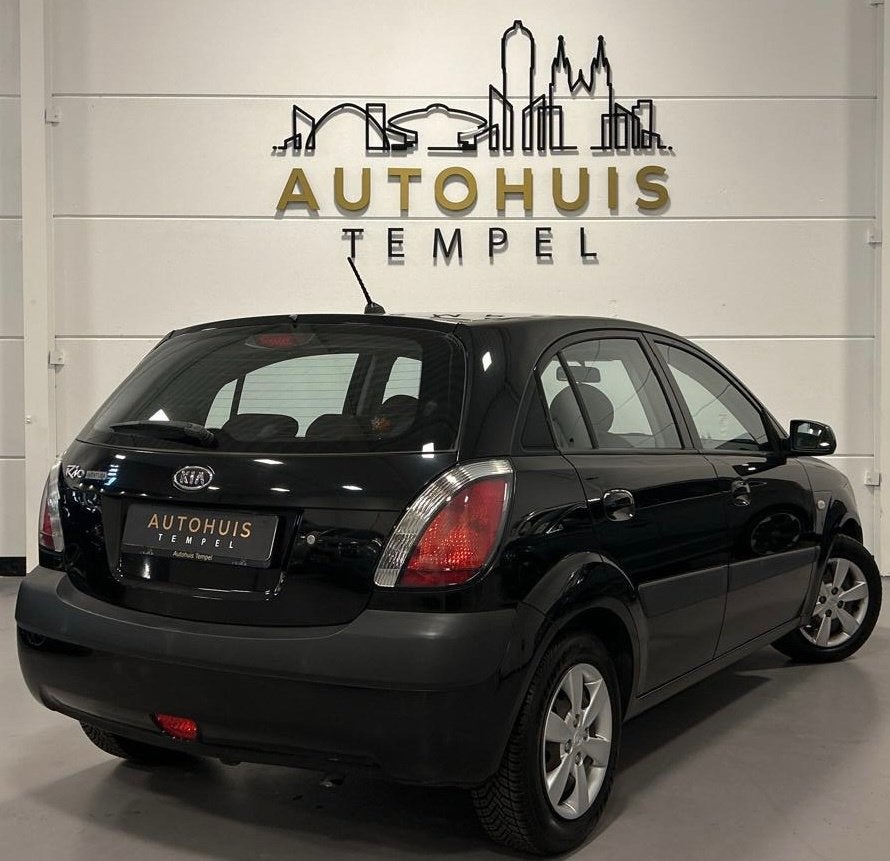 Kia Rio 1.4 All Stars Sport Automaat Airco Elektrische Ramen, Auto's, Kia, Stof, Gebruikt, 14 km/l, Grijs