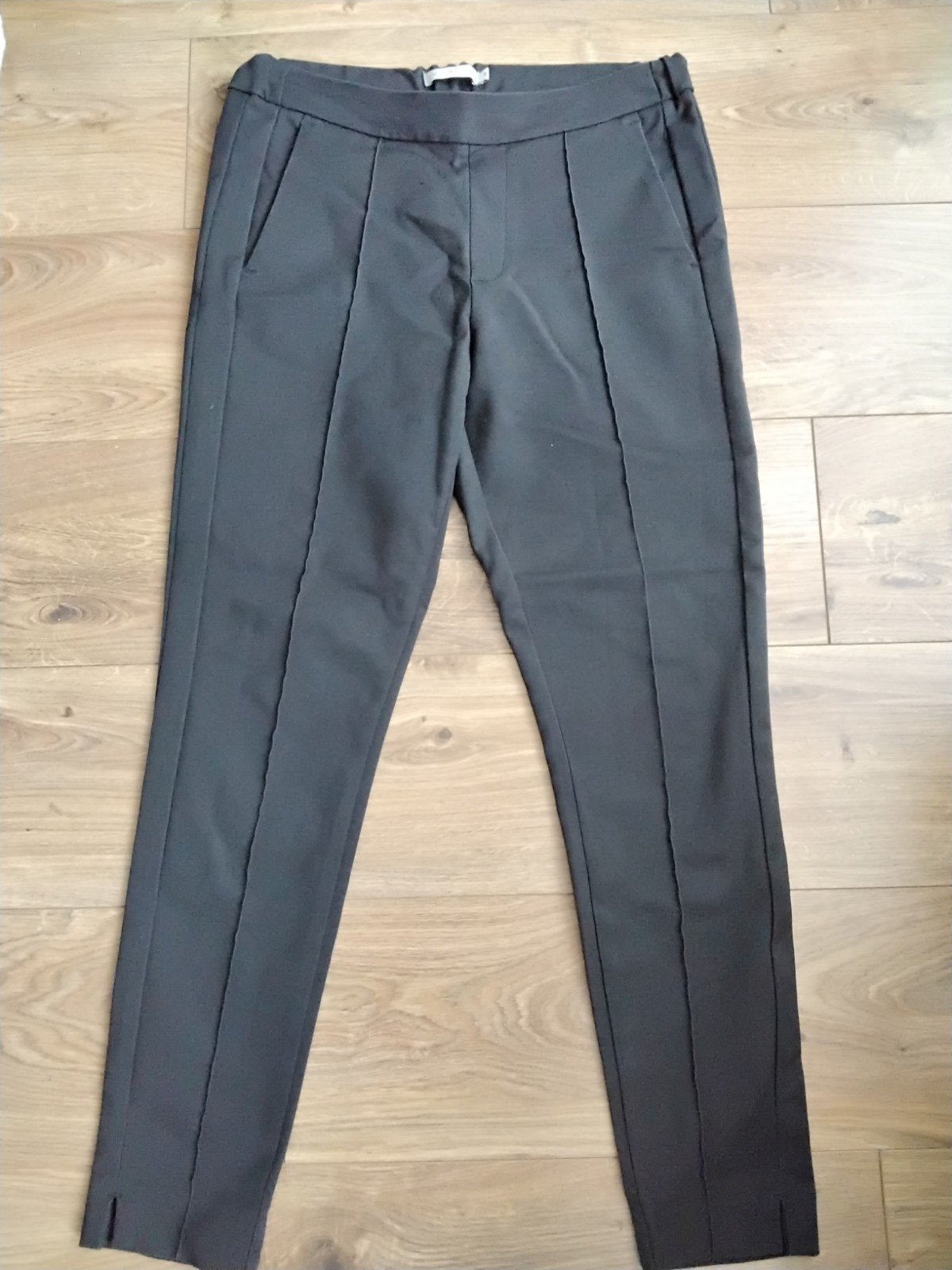 NUKUS zwarte broek met splitje onderaan,M, Maat 38/40 (M), Zwart, Ophalen of Verzenden, Zo goed als nieuw