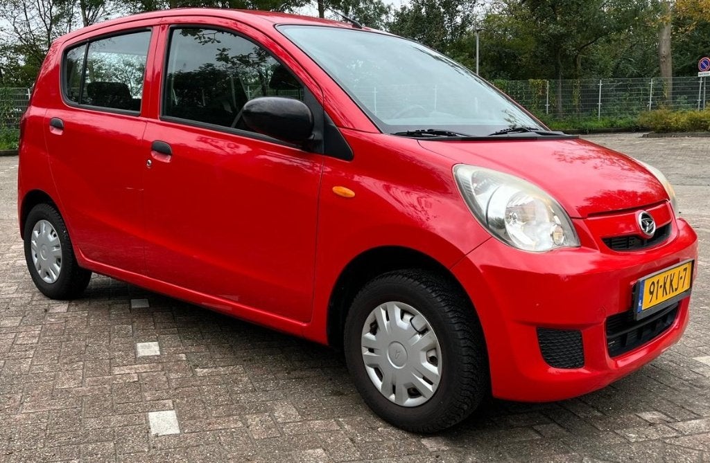 Daihatsu Cuore 1.0 5 Deurs 2007 Rood, Auto's, Voorwielaandrijving, Stof, 600 kg, 18 €/maand