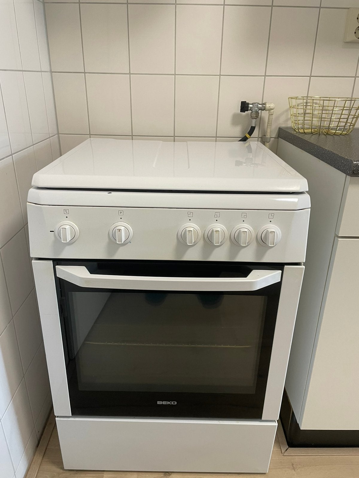 Beko gasfornuis met oven + afzuigkap €70, Ophalen, Gebruikt, 4 kookzones, Gas