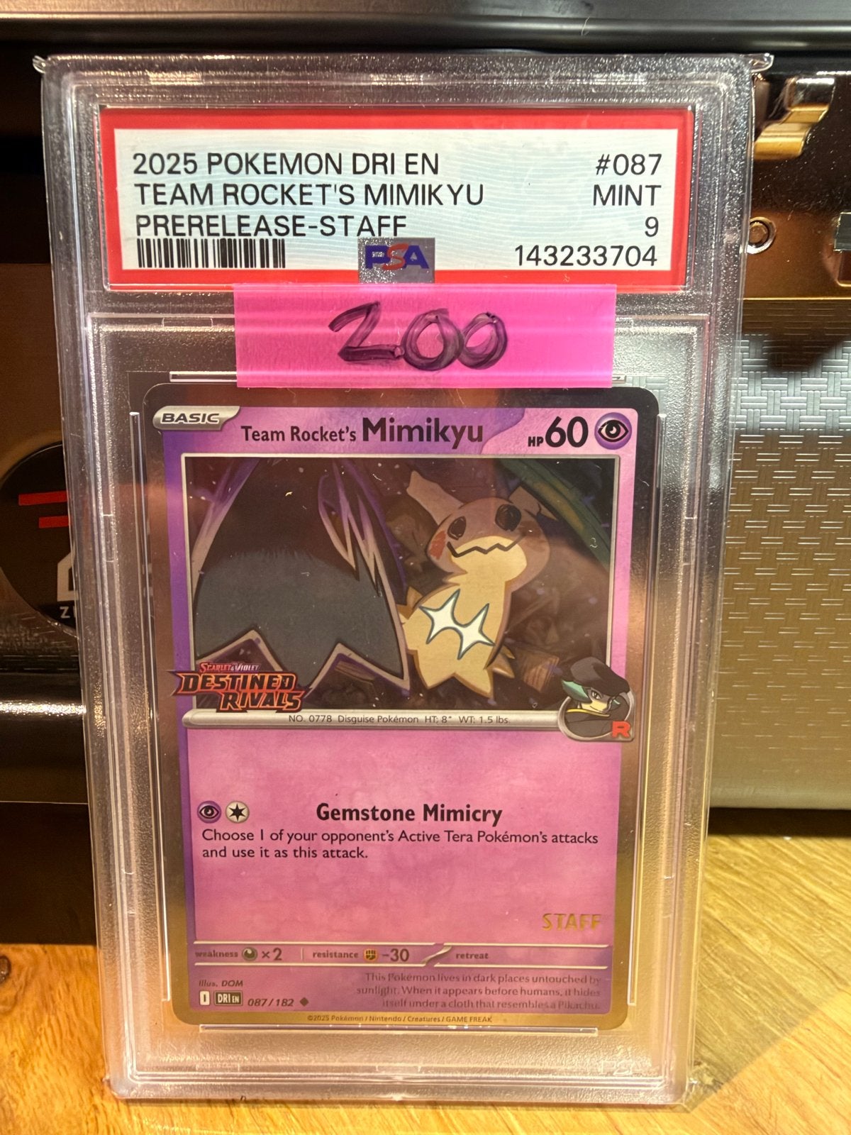 PSA 9 Team Rocket's Mimikyu Prerelease-Staff Pokémon Kaart, Ophalen of Verzenden, Zo goed als nieuw, Losse kaart