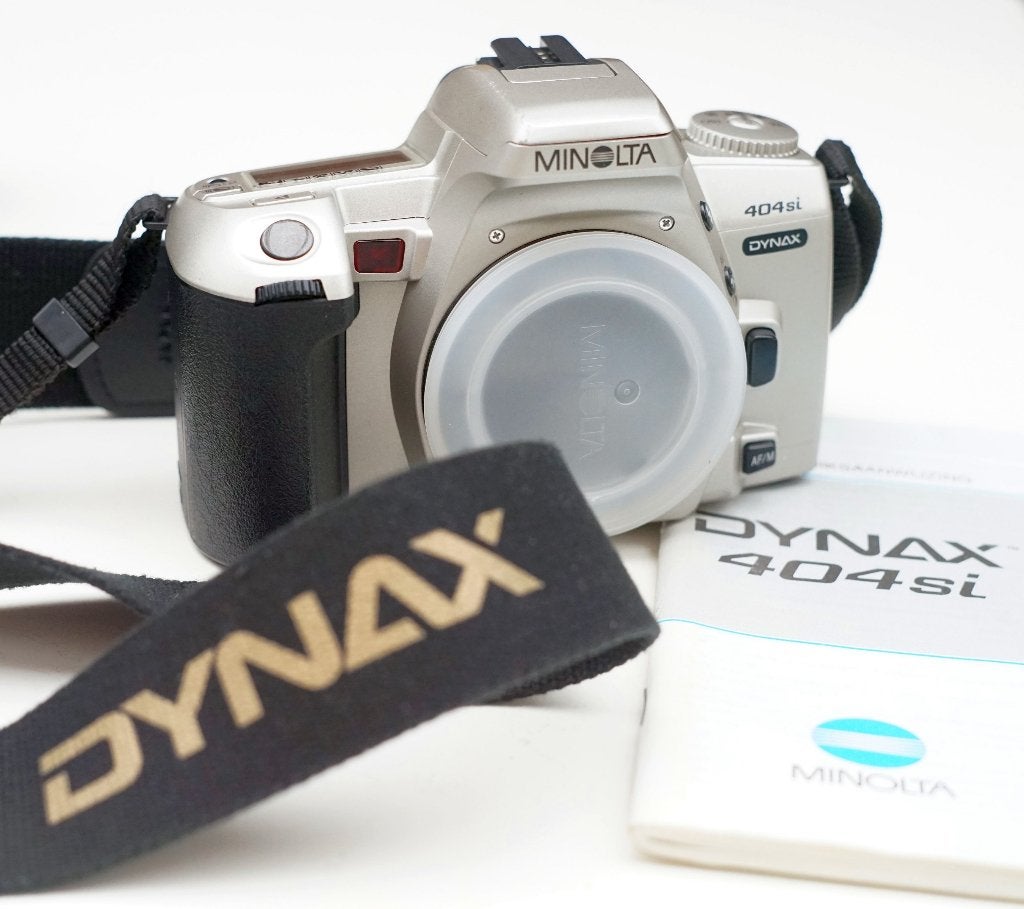 Minolta 404si Dynax en camerariem (ongetest, for parts), Ophalen of Verzenden, Compact, Overige Merken