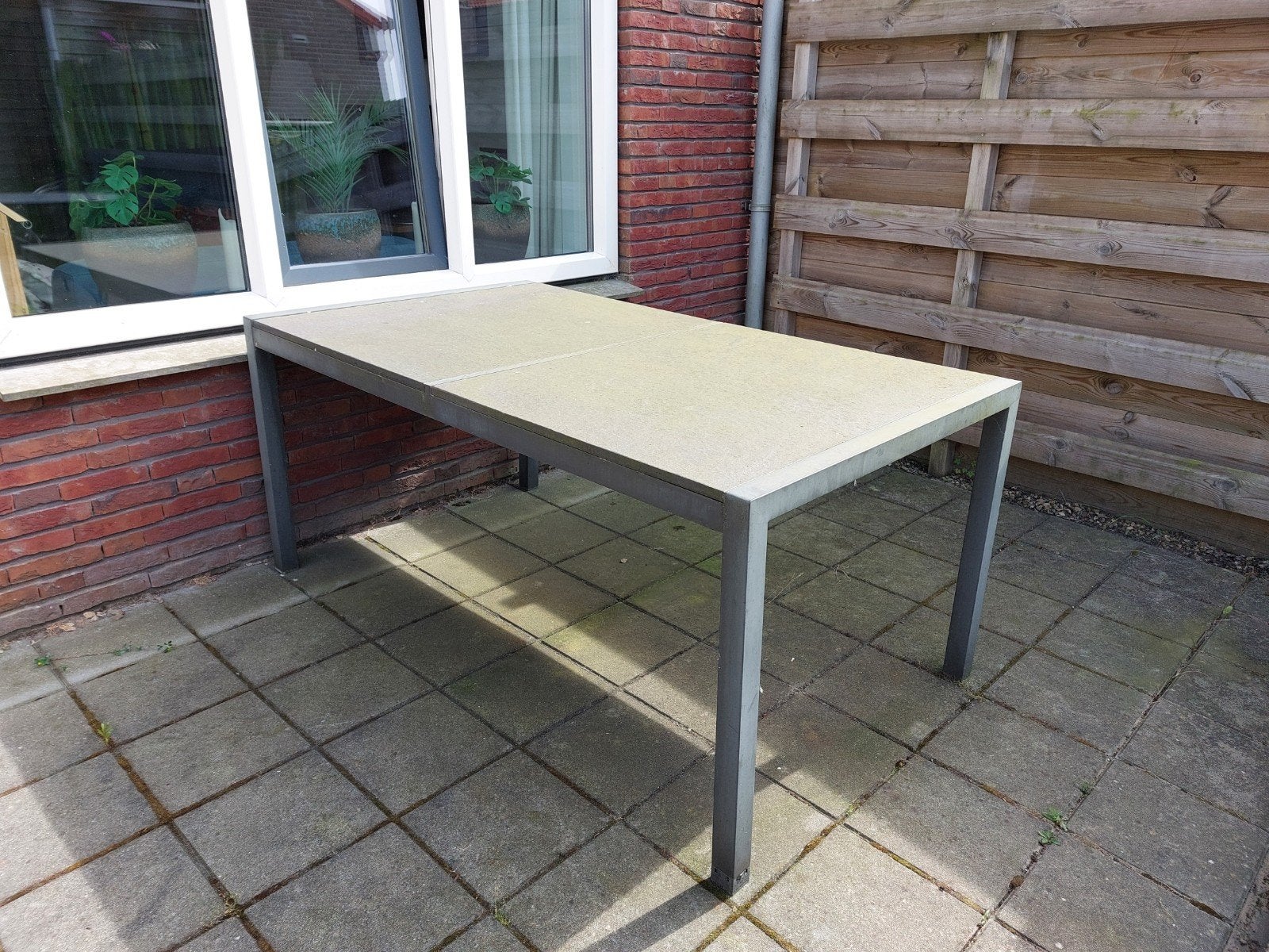 RVS Buitentafel 1.69x0.96m met 2 natuurstenen bladen, Tuin en Terras, Tuintafels, Ophalen