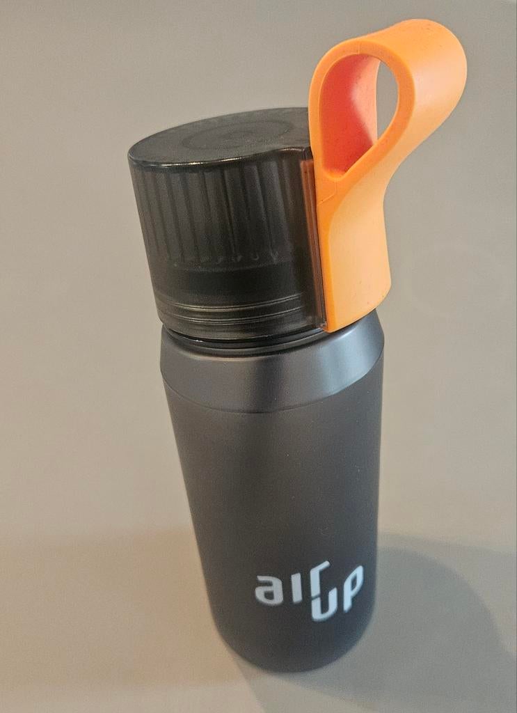 Air Up drinkfles met oranje podhouder, Sport en Fitness, Bidons, Ophalen of Verzenden, Zo goed als nieuw