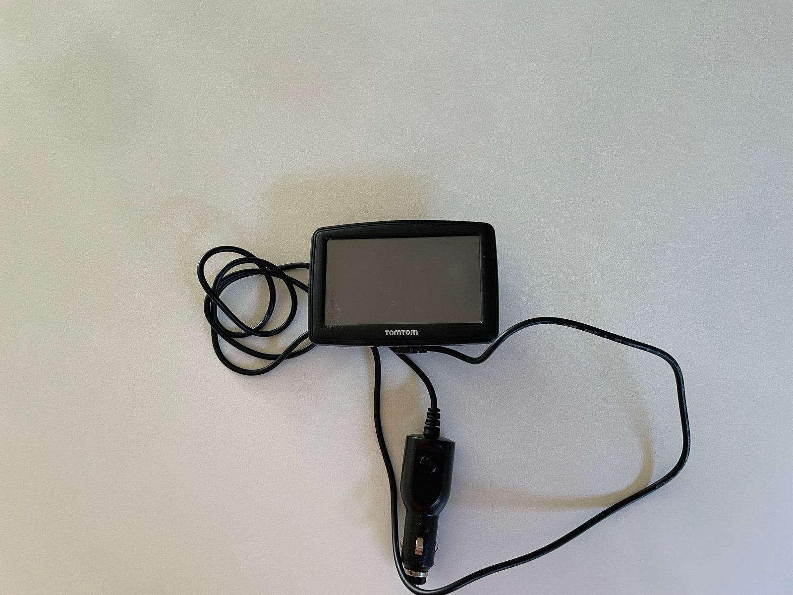 TomTom navigatiesysteem met autolader, Ophalen of Verzenden, Gebruikt