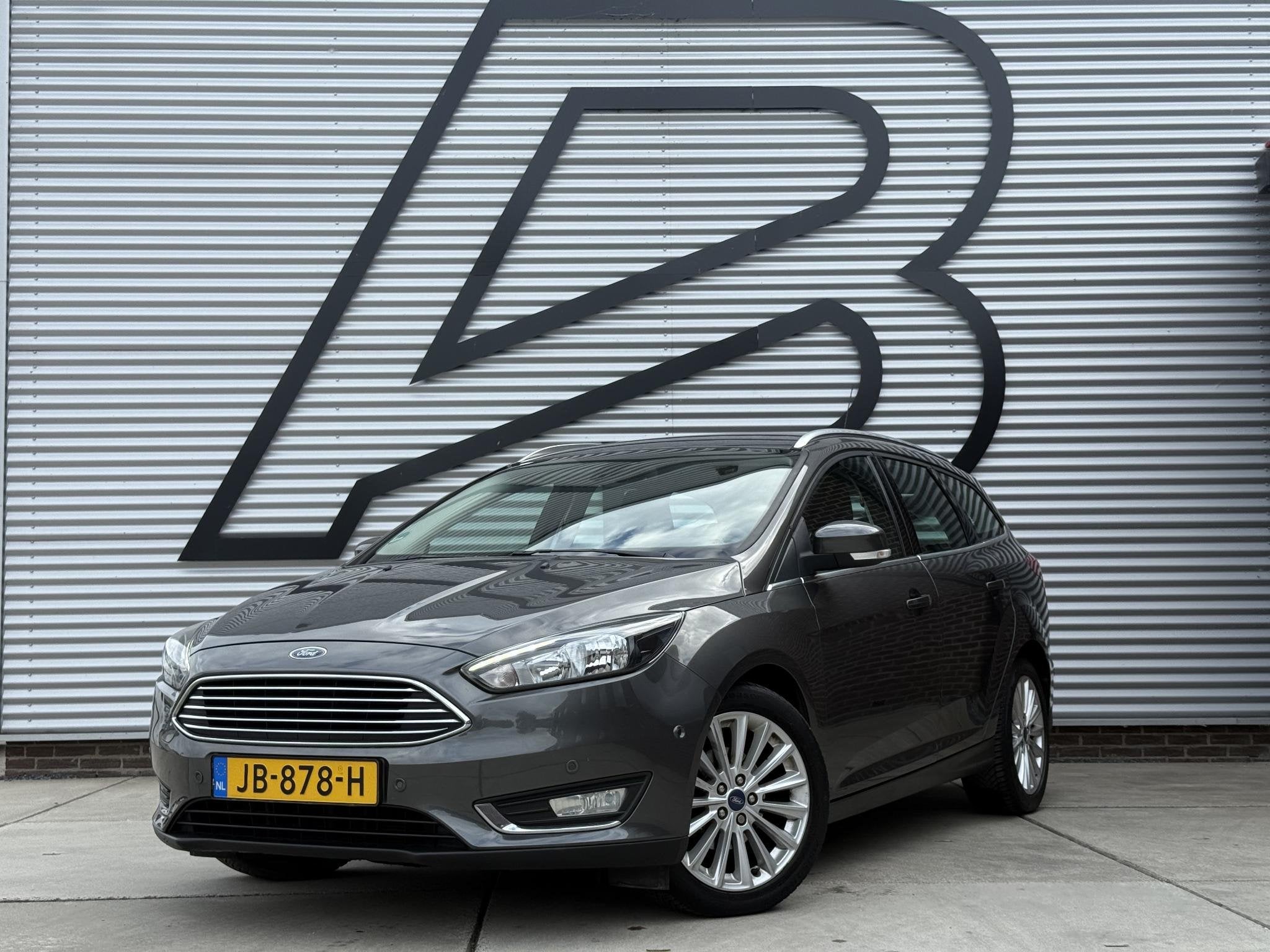 Ford Focus Wagon 1.0 Titanium 2e Eigenaar|Clima|Cruise|PDC V, Gebruikt, Euro 6, Handgeschakeld, 1216 kg