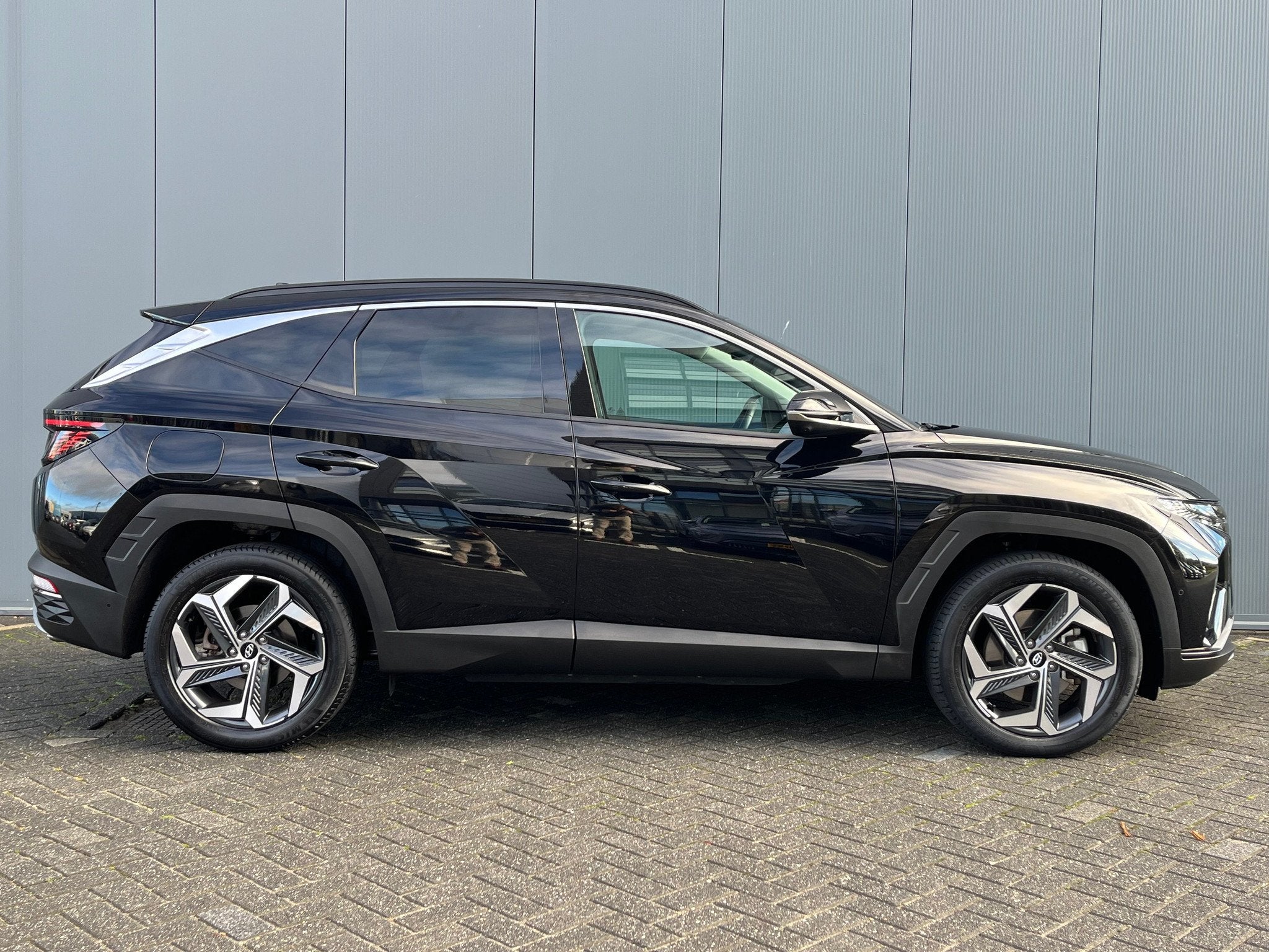 Hyundai Tucson 1.6 T-GDI 265pk PHEV Premium 4WD, Auto's, Hyundai, Gebruikt, 4 cilinders, Zwart, Bedrijf