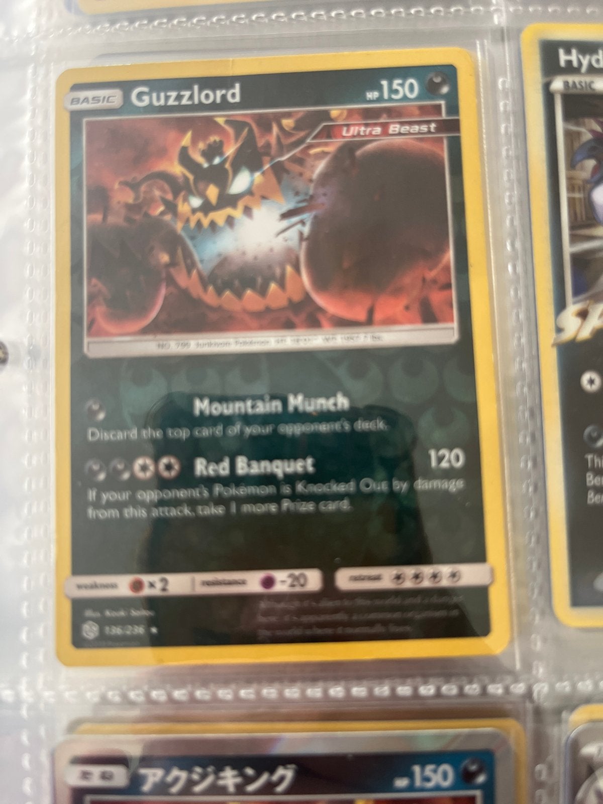 Guzzlord Pokémon kaart #136 reverse holo, Ophalen of Verzenden, Gebruikt, Losse kaart