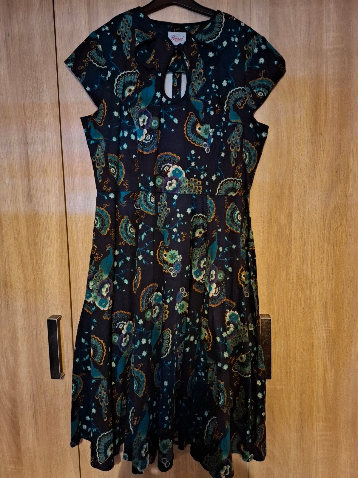 Banned Retro jurk met pauwenprint - Maat XL, Blauw, Maat 42/44 (L), Ophalen of Verzenden, Onder de knie