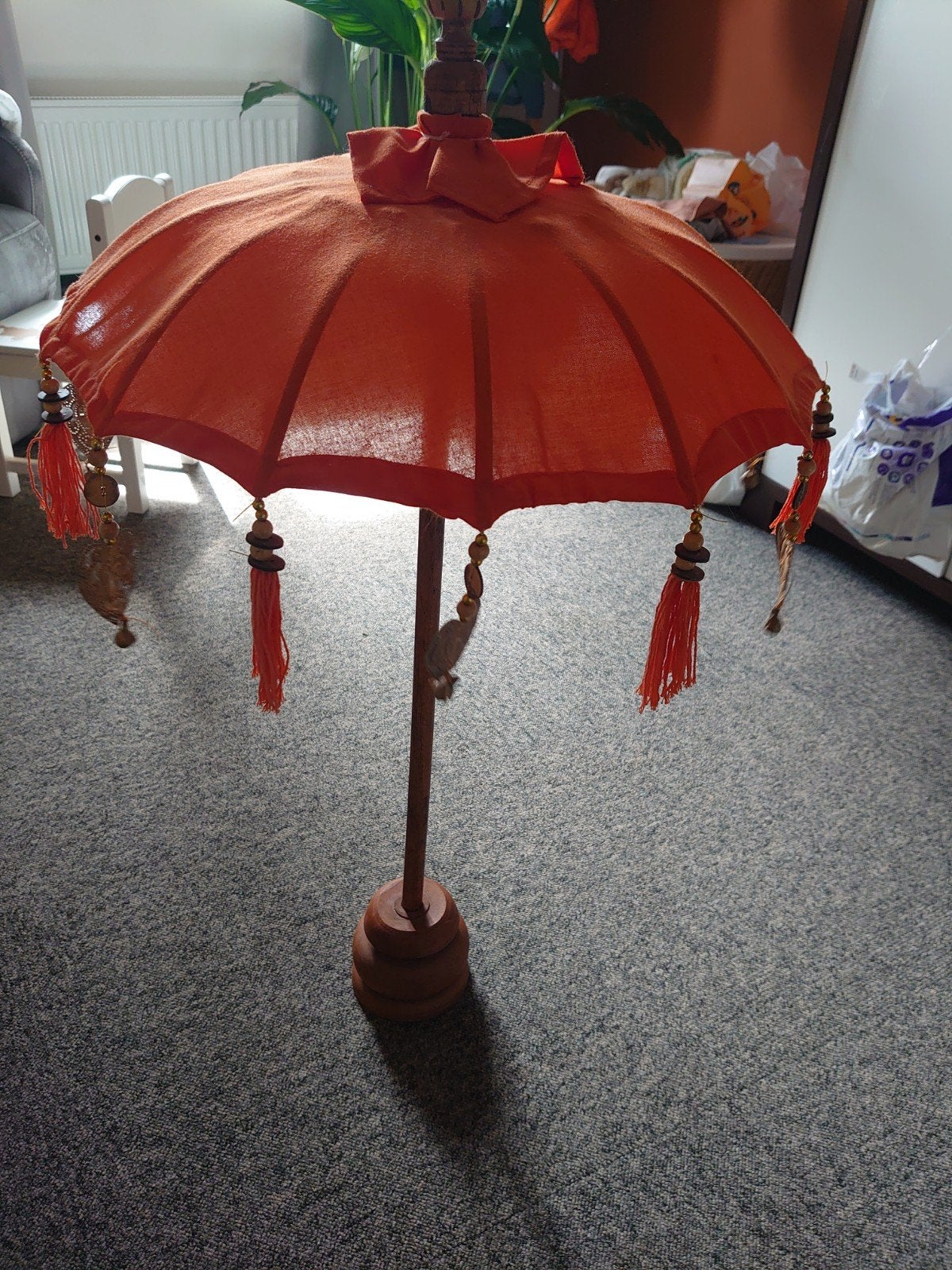Parasol paraplu oranje, Ophalen