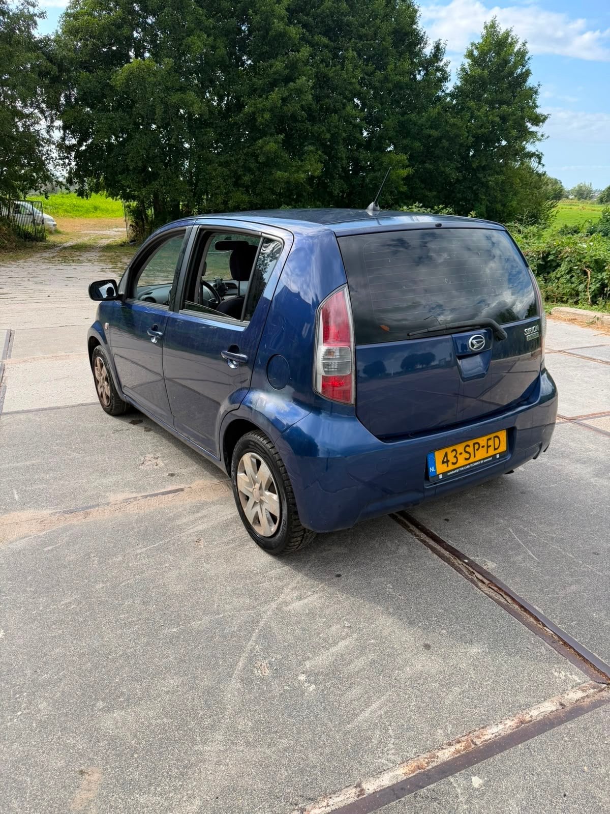 Daihatsu Sirion 1.0 51KW 2006 Blauw, Auto's, Voorwielaandrijving, Blauw, Handgeschakeld, 3 cilinders