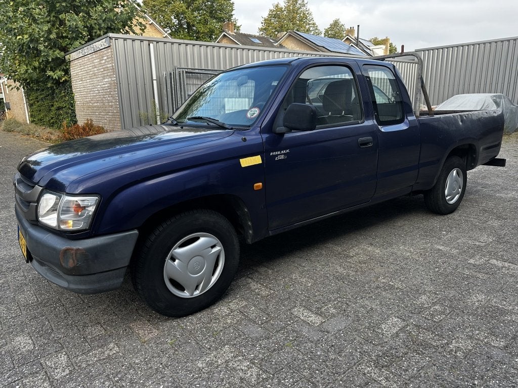 Toyota Hilux 2.5 D4-D 2002 79000km NAP UNIEK APK 9-26, Auto's, Stof, Gebruikt, Zwart, Blauw