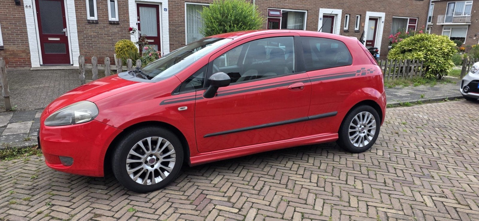 Fiat Grande  Punto 1.2 racing 3D, Stof, 40 €/maand, 4 cilinders, Origineel Nederlands