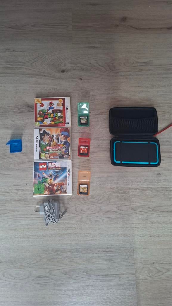 Nintendo 2DS XL met 6 spellen en 2 hoesjes, Gebruikt, Ophalen of Verzenden, Met beschermhoes of tas, Zwart