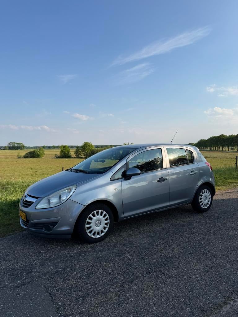 Opel Corsa 1.0 12V 5D 2007 Grijs, Auto's, Opel, Voorwielaandrijving, 40 €/maand, 1045 kg, Handgeschakeld