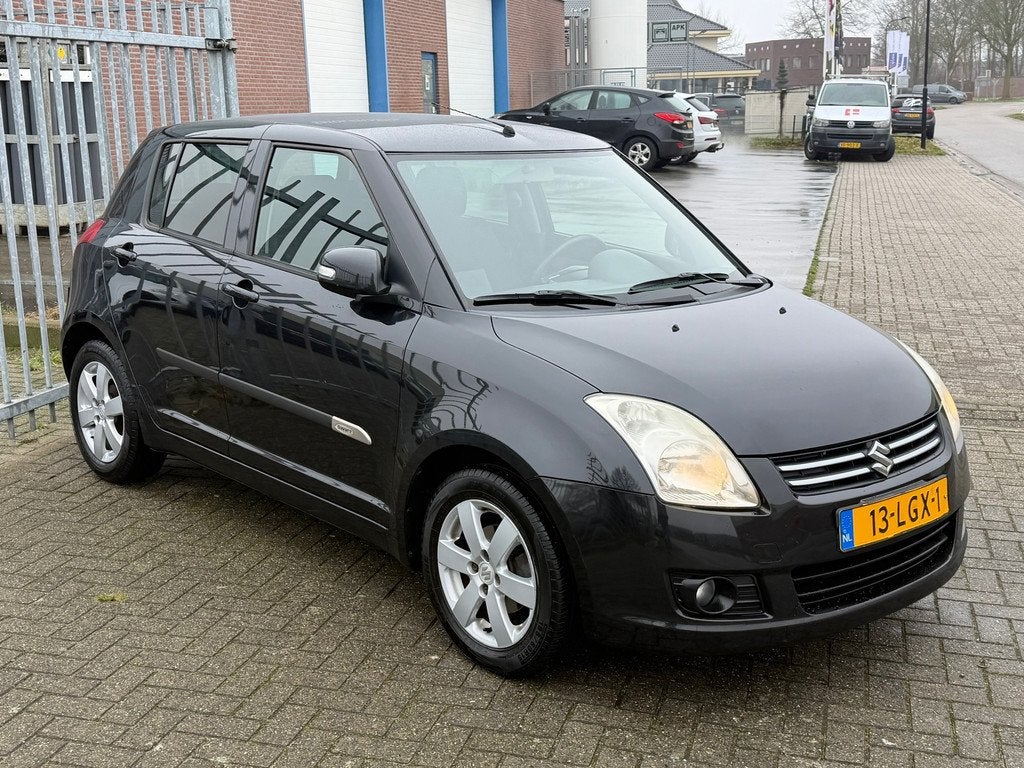 Suzuki Swift 1.3 Limited 5 deurs 93PK! KMST NAP! AIRCO l STO, Auto's, Suzuki, Voorwielaandrijving, Zwart, 400 kg, Alcantara