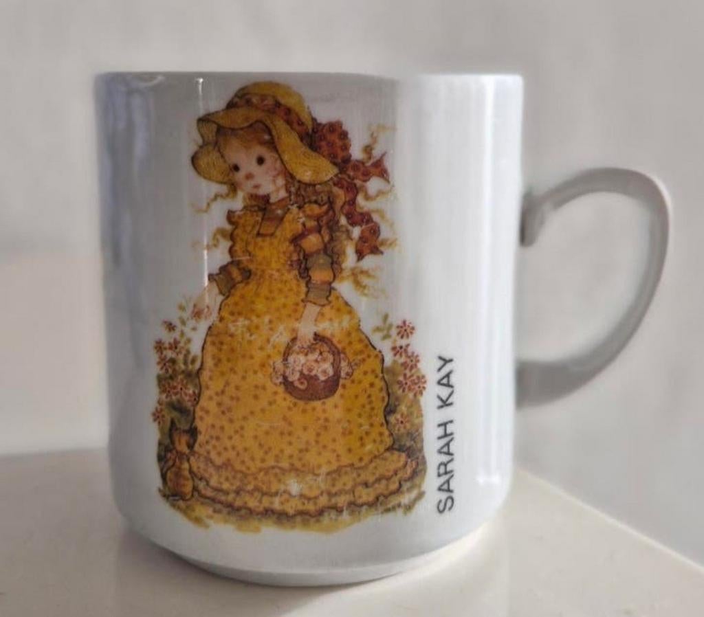 Monopoli Beker Sarah Kay, Huis en Inrichting, Keuken | Servies, Ophalen of Verzenden, Zo goed als nieuw, Overige stijlen, Kop(pen) en/of Schotel(s)