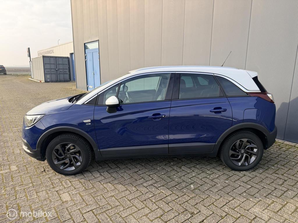 Opel Crossland X 1.2 Turbo 120 Jaar Edition automaat allseas, Auto's, 12 maanden, 840 kg, Gebruikt, Euro 6