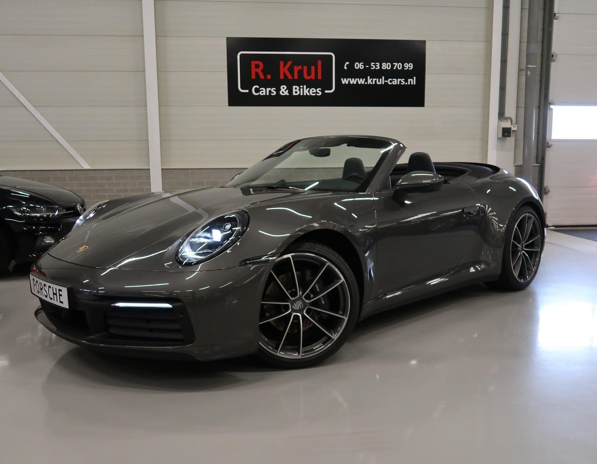 Porsche 911 Cabrio 3.0 Carrera 992 Bose 360 Camera Sportuitl, Auto's, Automaat, Dealer onderhouden, Achterwielaandrijving, Gebruikt