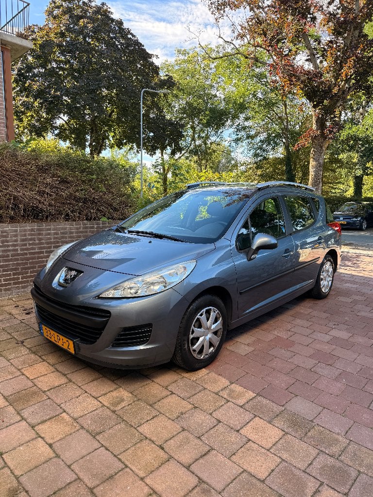 Peugeot 207 1.4 95pk 2010 Metallic Grey, Auto's, Voorwielaandrijving, Stof, Origineel Nederlands, Stationwagon