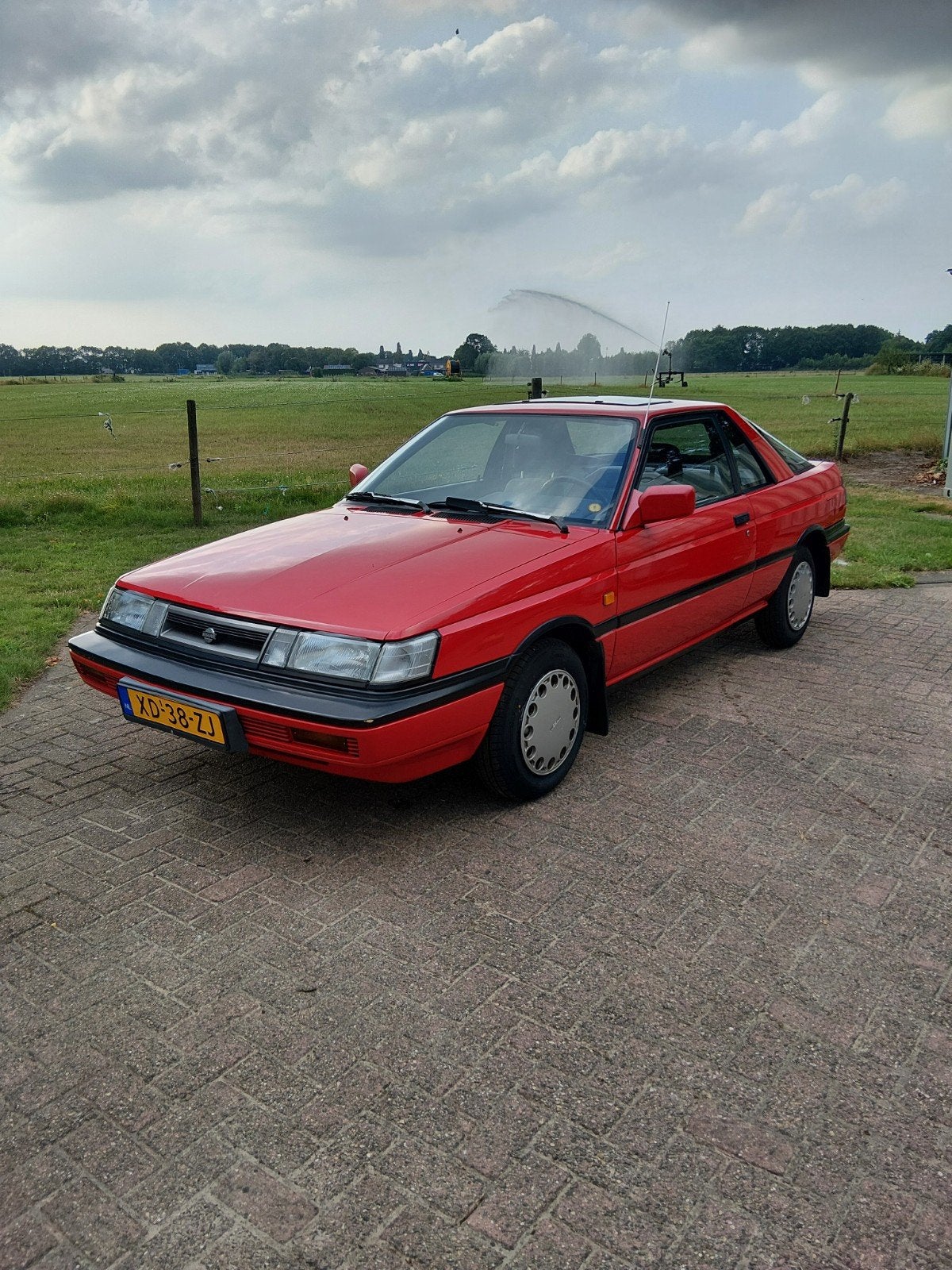 Nissan Sunny 1.6 I Coupe K6 1989 Rood, Auto's, Voorwielaandrijving, Origineel Nederlands, Handgeschakeld, Particulier