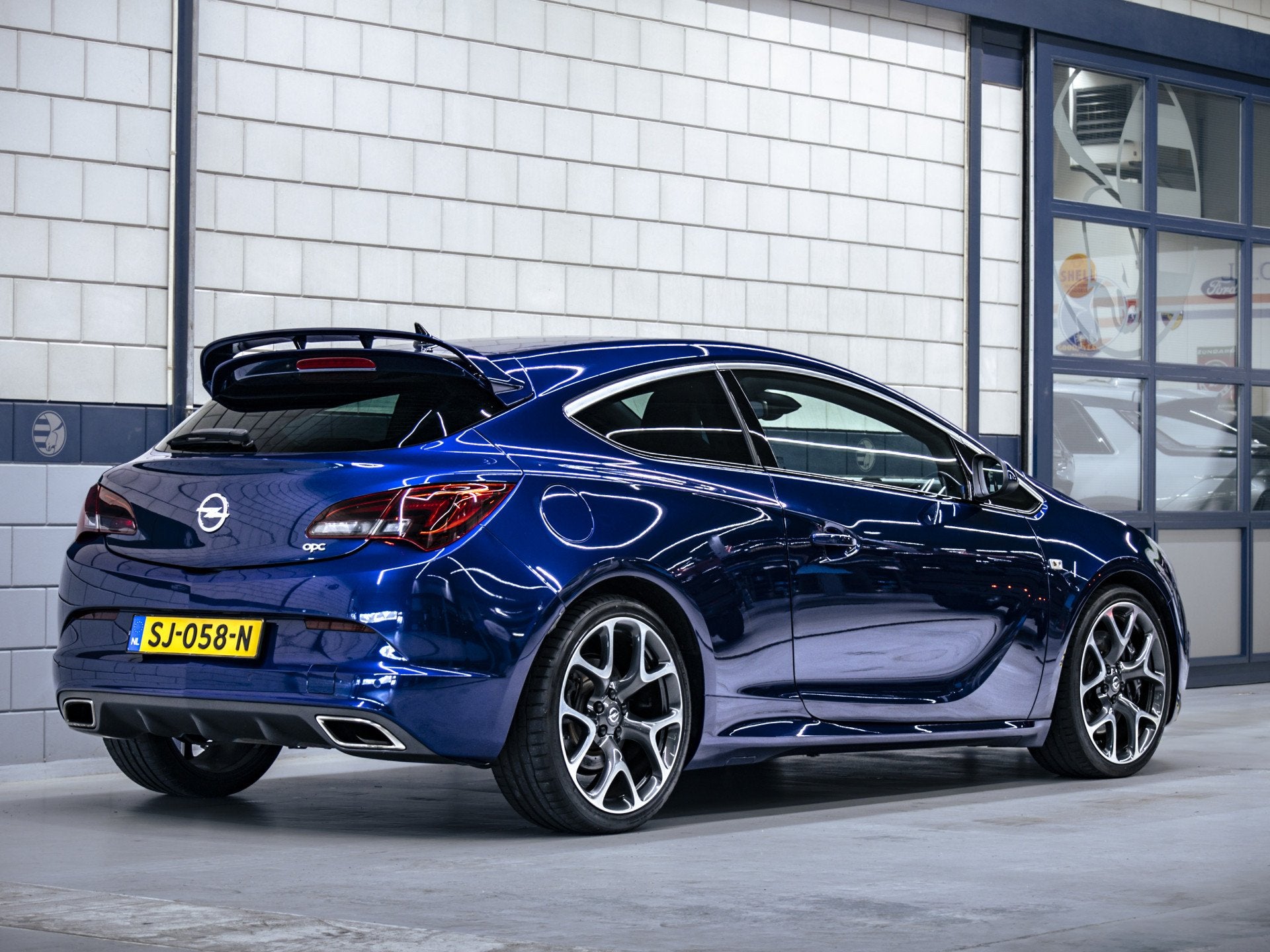 Opel Astra GTC 2.0 Turbo OPC (bj 2013), Auto's, Gebruikt, 4 cilinders, Blauw, Leder