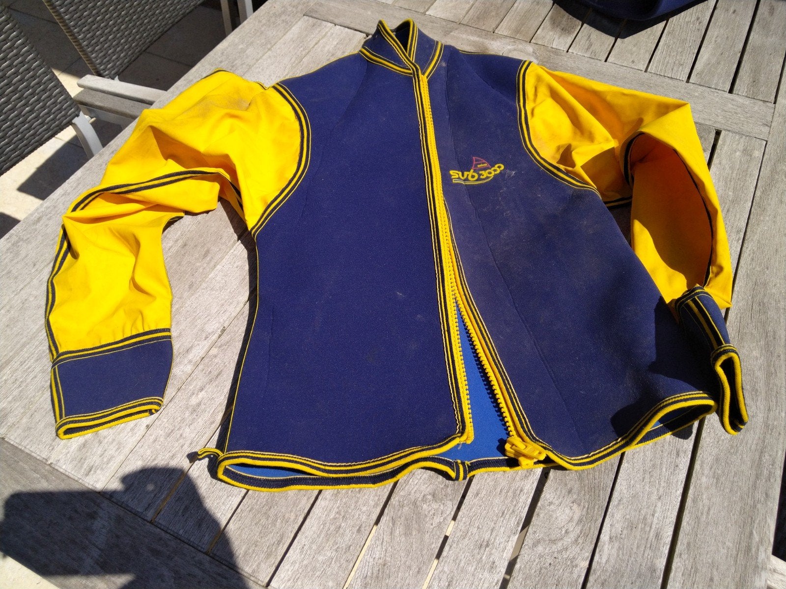 Surfpak maat 46-48 in nieuwstaat, Ophalen of Verzenden, Zo goed als nieuw, Regenjas