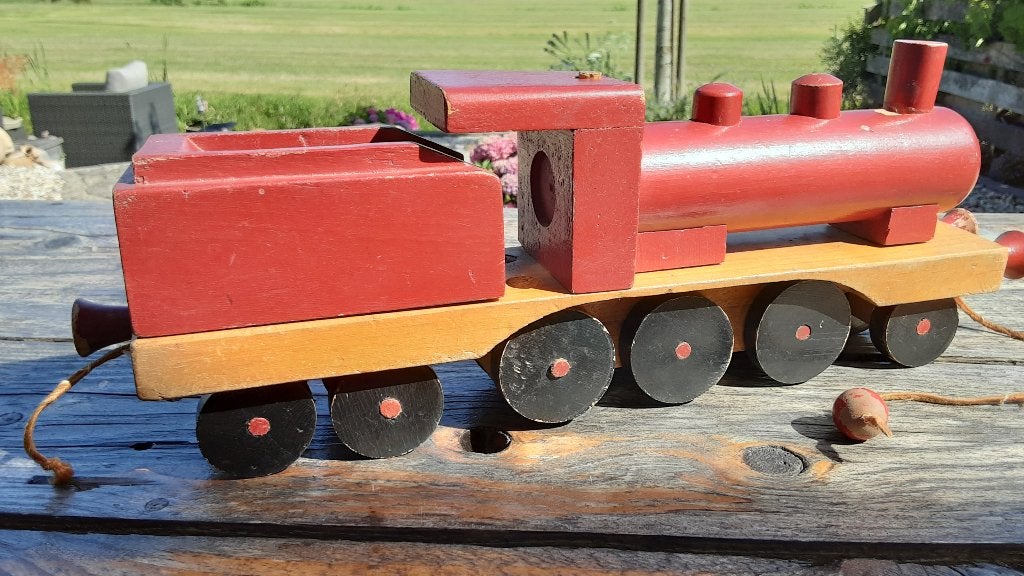 antieke houten speelgoedtrein, Ophalen
