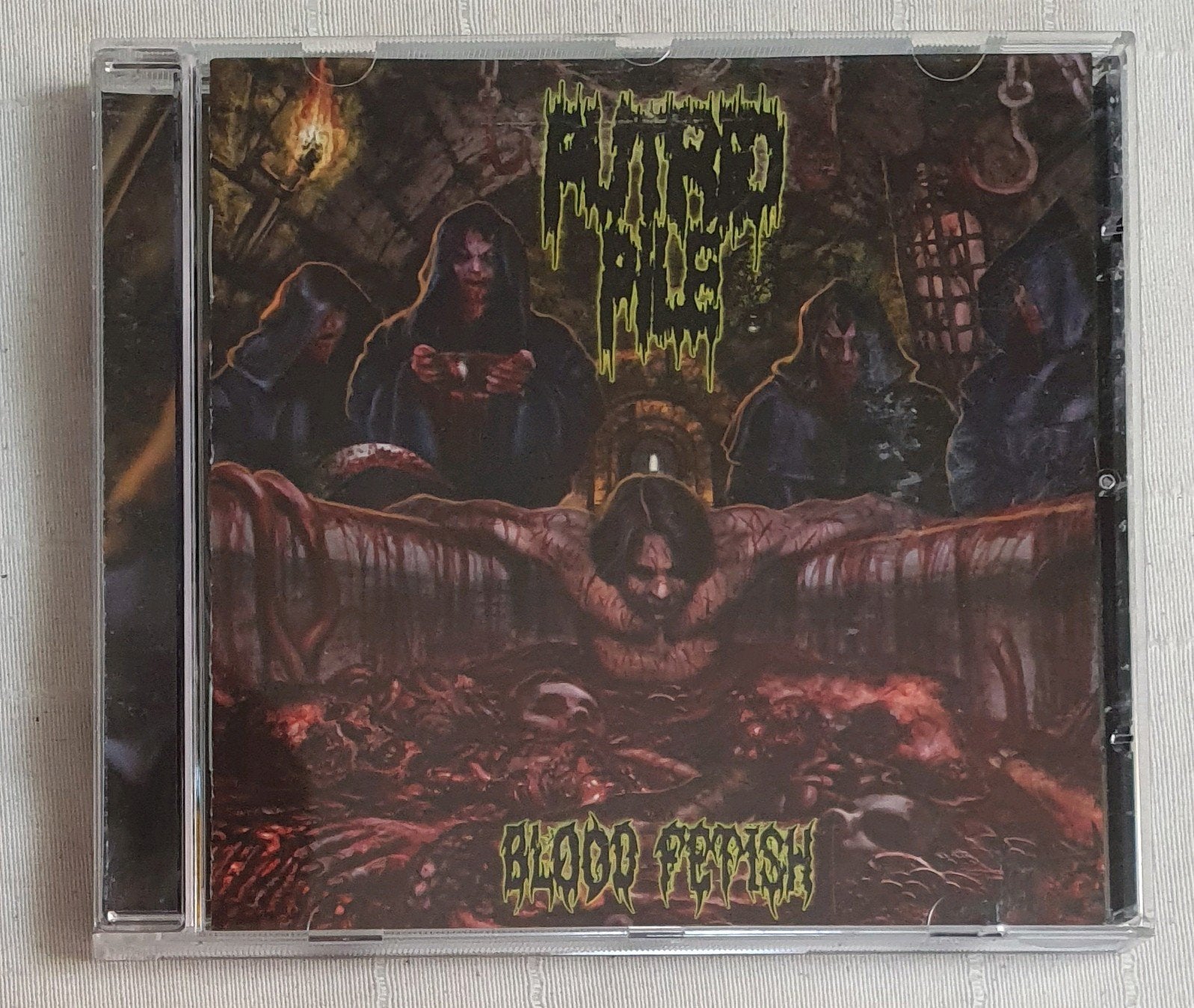 CD Pudrid pile - Blood fetish - 2012, Verzenden, Death metal, Zo goed als nieuw, Inclusief boekje