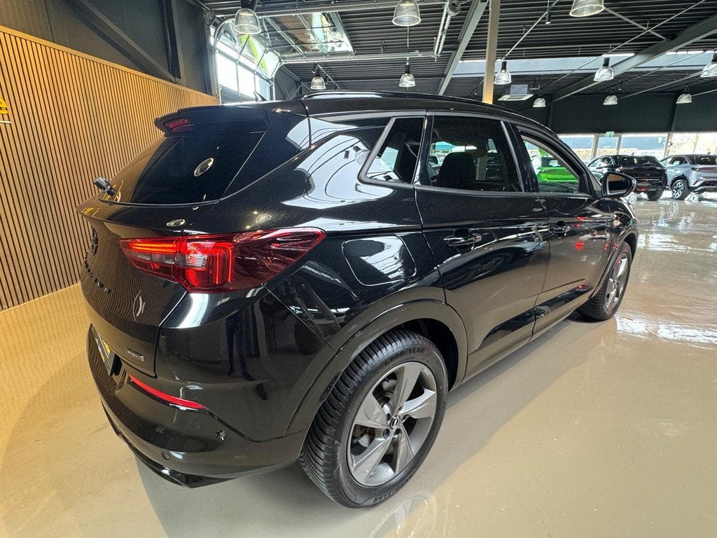 Opel Grandland 1.6 Turbo Plug-In Hybrid Ultimate Black Edtio, Stof, Gebruikt, 4 cilinders, Met garantie (alle)