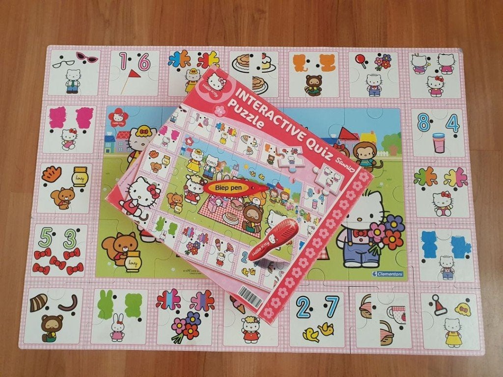 Zo goed als nieuwe interactieve quiz puzzle van Hello Kitty, Ophalen of Verzenden, 10 tot 50 stukjes, Zo goed als nieuw, 4 tot 6 jaar