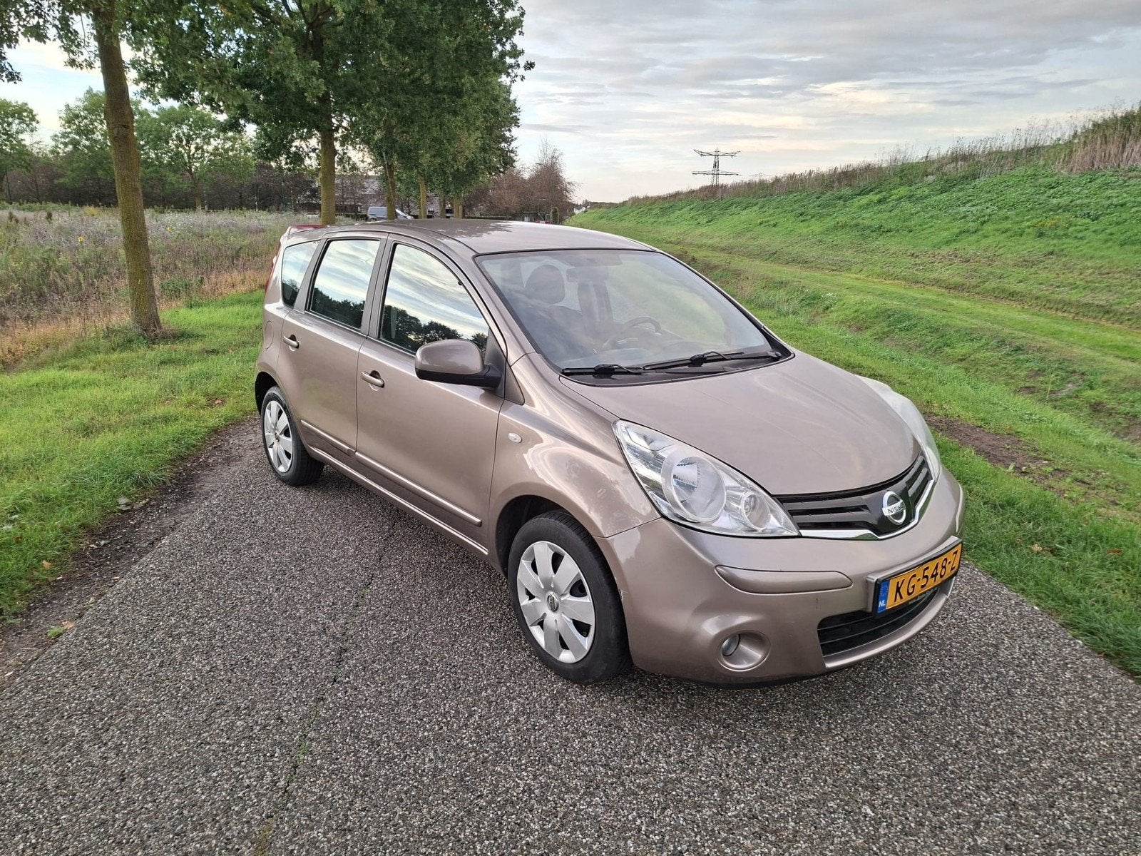 Nissan Note 1.6 16V AUT 2010 Bruin, Auto's, 15 km/l, 750 kg, 4 cilinders, Bruin