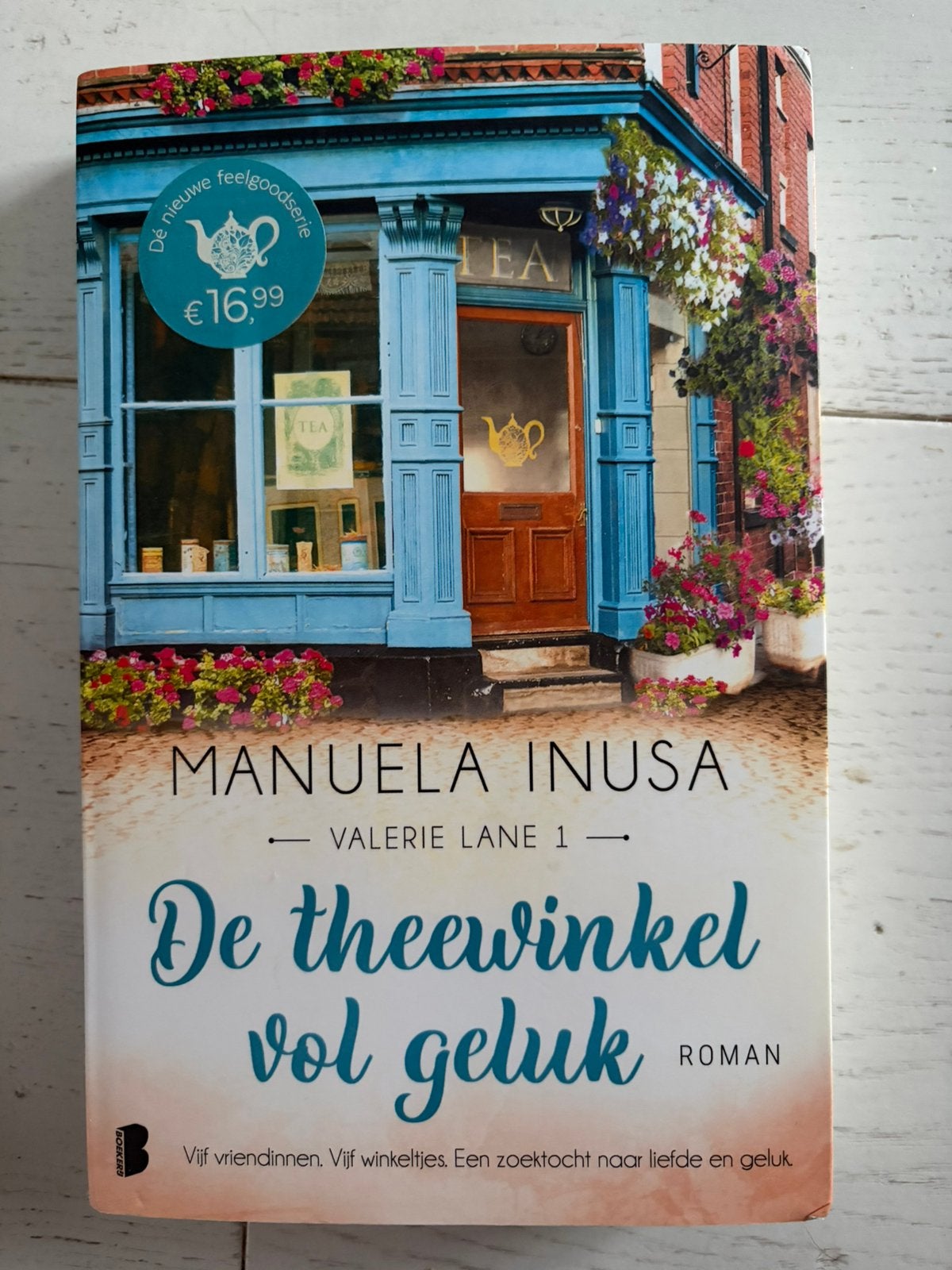 Manuela Inusa - De theewinkel vol geluk, Ophalen of Verzenden, Zo goed als nieuw, Manuela Inusa
