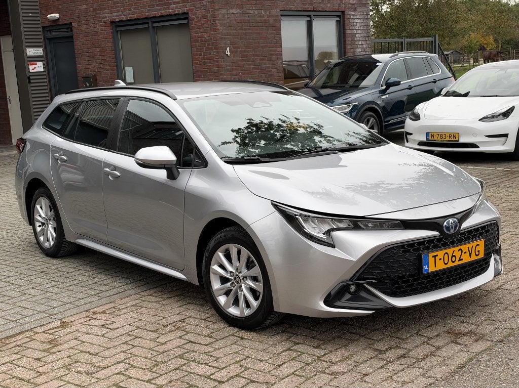 Toyota Corolla TS Hybrid 140 Active | FACELIFT, Auto's, 4 cilinders, Verwarmde buitenspiegels, Corolla, Hybride Elektrisch/Benzine