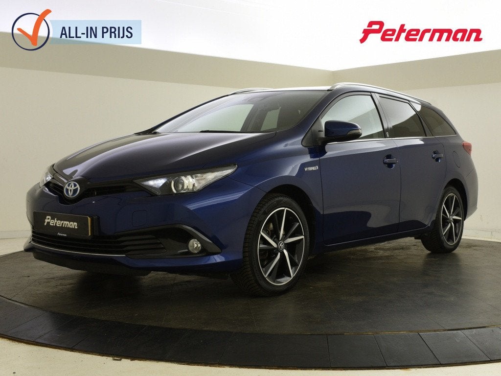 Toyota Auris Touring Sports 1.8 Hybrid Team D (bj 2018), Auto's, Automaat, Gebruikt, 4 cilinders, Blauw