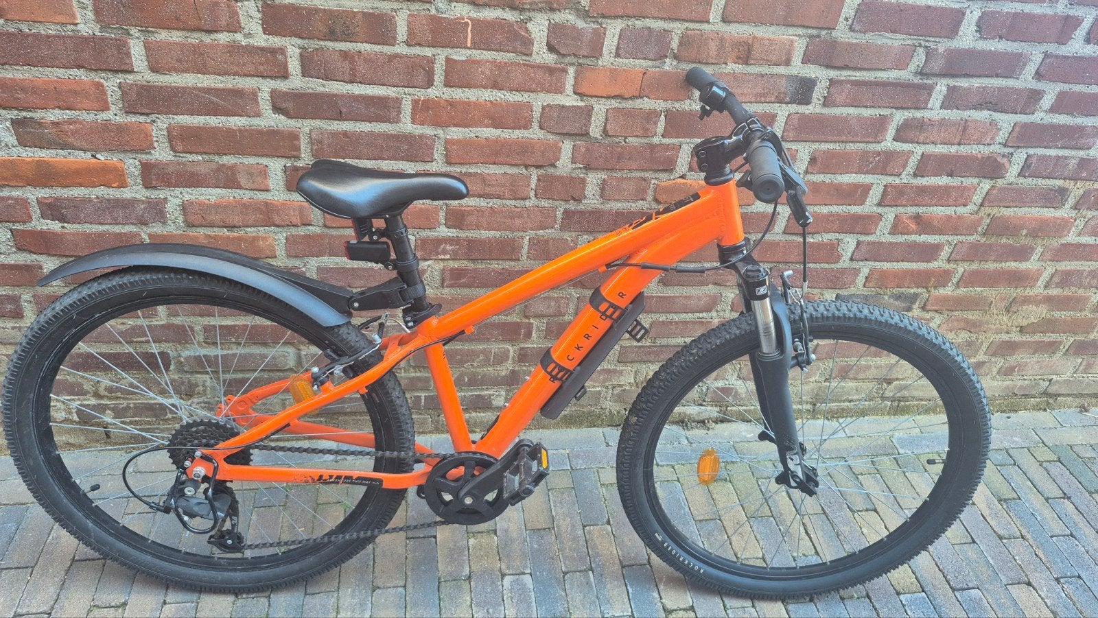 Rockrider 26 inch kinderfiets - Oranje - Zo goed als nieuw, Fietsen en Brommers, Fietsen | Mountainbikes en ATB, Ophalen, Zo goed als nieuw