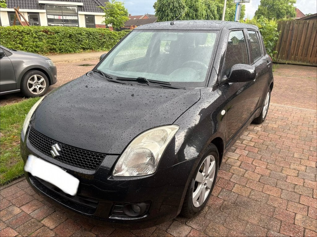 Suzuki Swift 1.3 5D 2009 Zwart, Auto's, Suzuki, Voorwielaandrijving, 40 €/maand, Zwart, Origineel Nederlands
