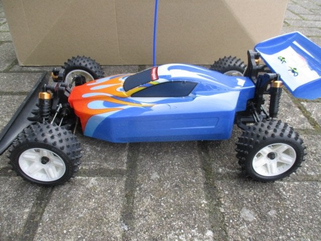 Kyosho buggy met doos en boekje, Hobby en Vrije tijd, Modelbouw | Radiografisch | Auto's, Elektro, Gebruikt, Auto offroad, Ophalen of Verzenden