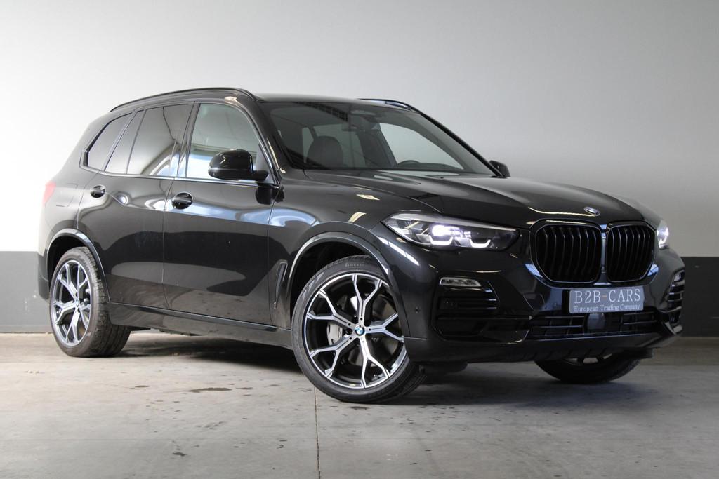 BMW X5 xDrive45e High Executive Luchtvering - LED - Lederen, Auto's, BMW, Lichtsensor, Gebruikt, 394 pk, Zwart