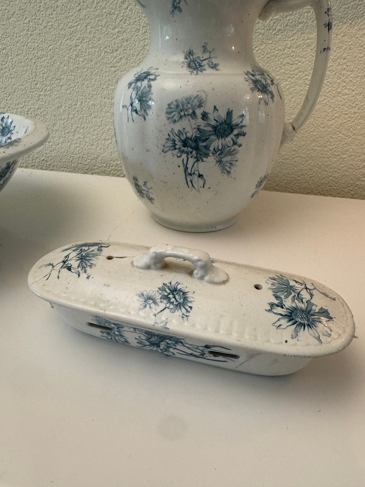 Lampetstel 3-delig met bloemmotief uit 1898-1910, Ophalen