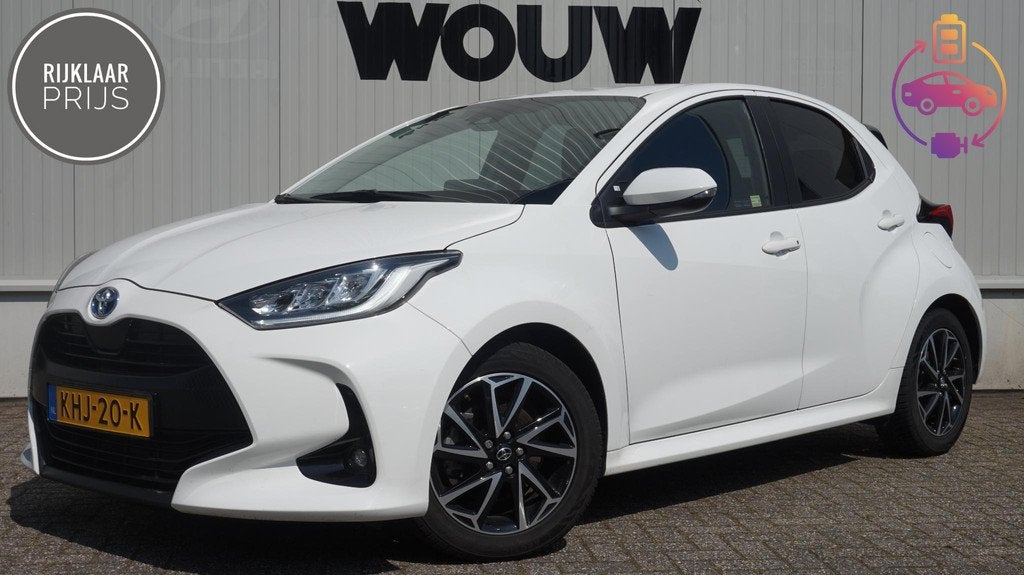 Toyota Yaris 1.5 Hybrid A/T 115PK Clima | Cruise | Carplay, Auto's, 12 maanden, Gebruikt, Euro 6, Wit