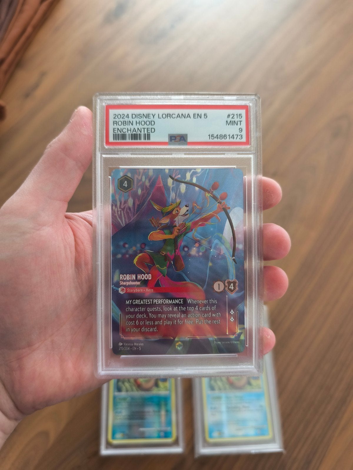 Lorcana Robin hood enchanted #215 - psa 9, Ophalen, Overige figuren, Nieuw, Beeldje of Figuurtje