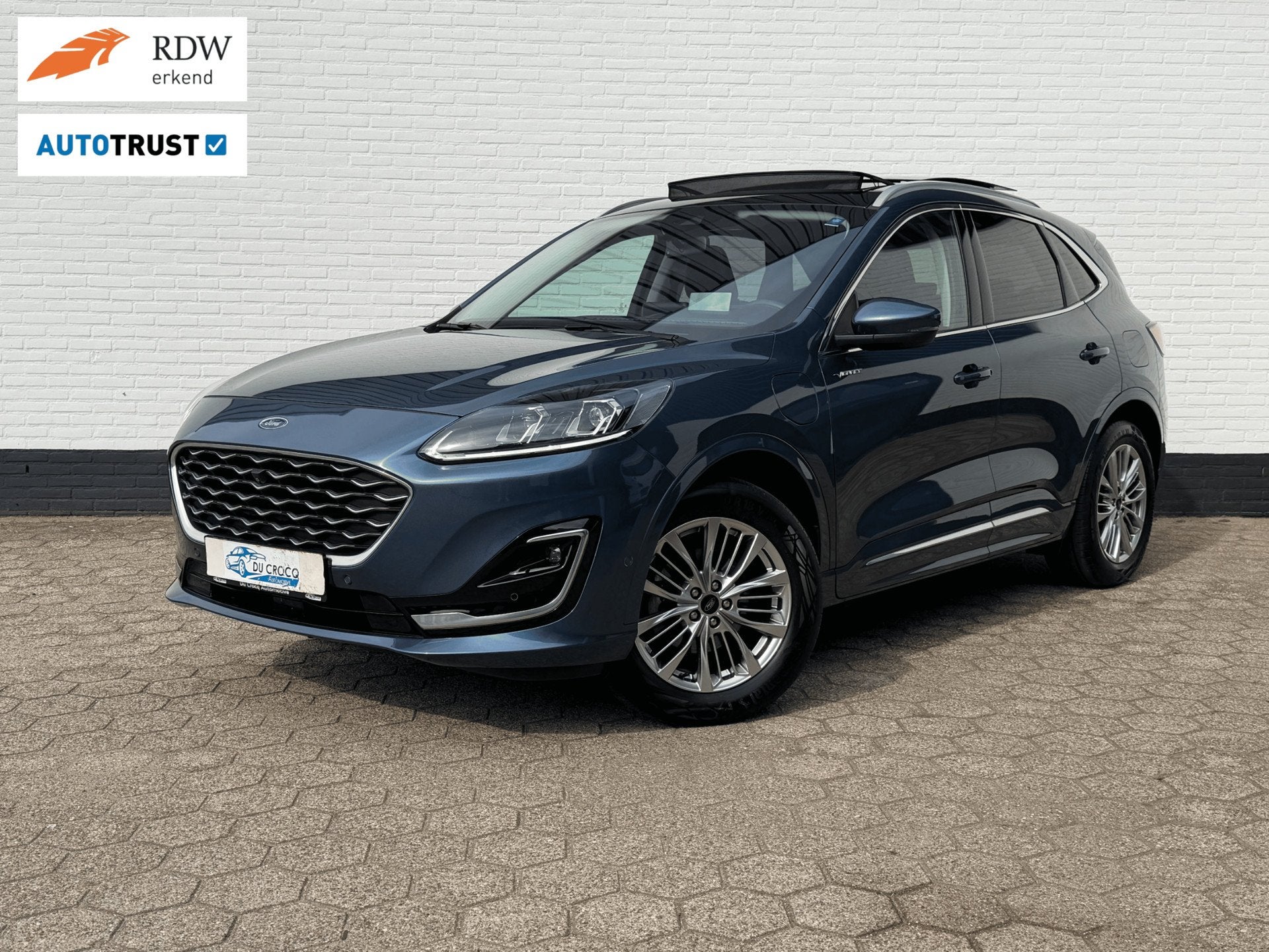 Ford Kuga 2.5 PHEV Vignale PANODAK l ACC l B&O l TREKHAAK, Auto's, Gebruikt, Zwart, 4 cilinders, Blauw