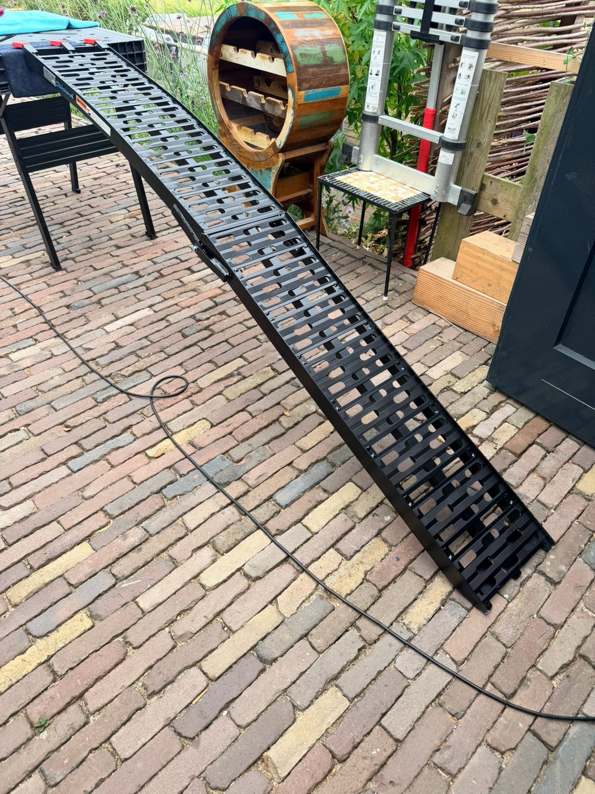 Opvouwbare aluminium oprijplaat, Ophalen