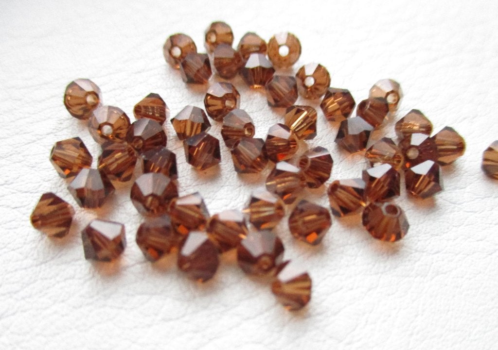 3029/ koffiebruine swarovski crystal bicone kralen, Ophalen of Verzenden, Nieuw, Kraal
