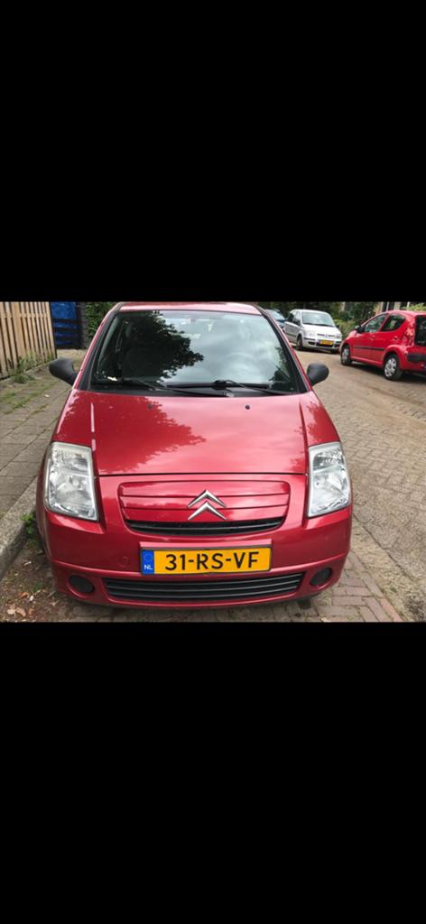 Citroën C2 1.4 I 2005 Rood, Voorwielaandrijving, 450 kg, Multifunctioneel stuurwiel, 4 cilinders