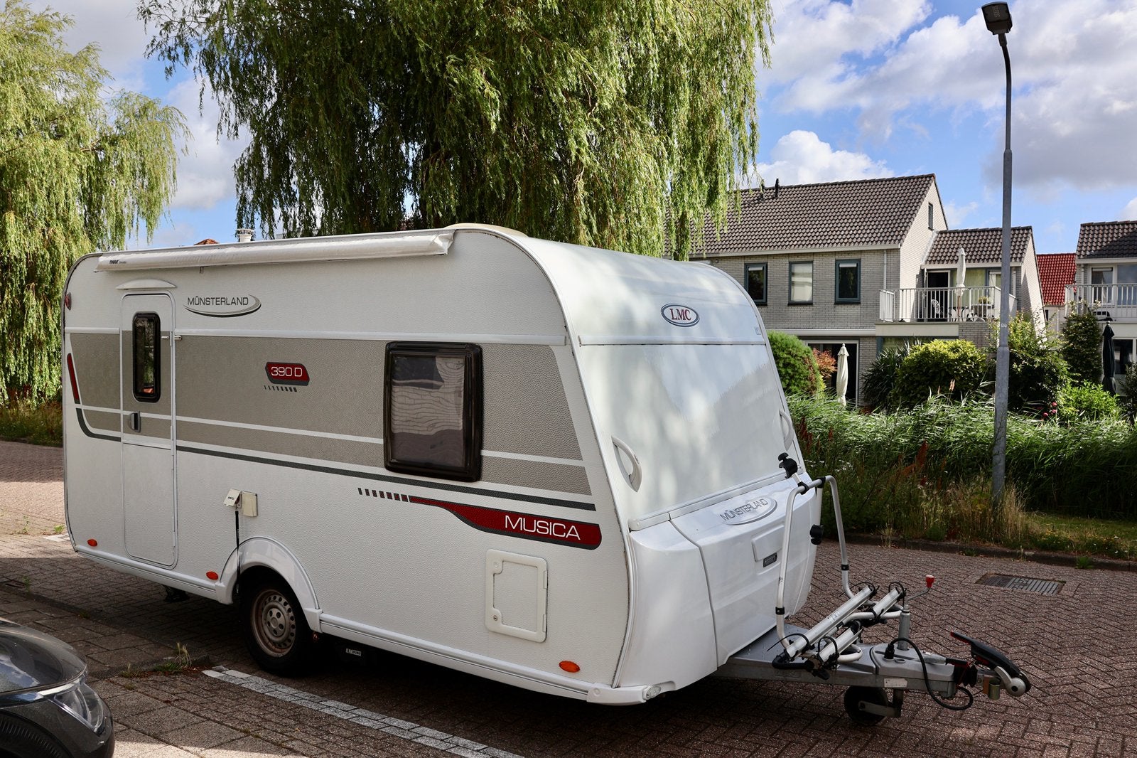 LMC Musica 390D (2014) met mover, luifel, fietsrek voortent, Schokbreker, Vast bed, Treinzit, Tot en met 3