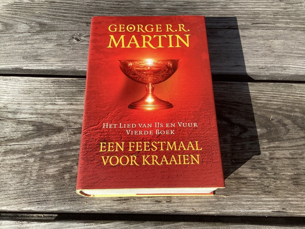 George R.R. Martin - Een Feestmaal voor kraaien, Ophalen of Verzenden, Zo goed als nieuw, George R.R. Martin