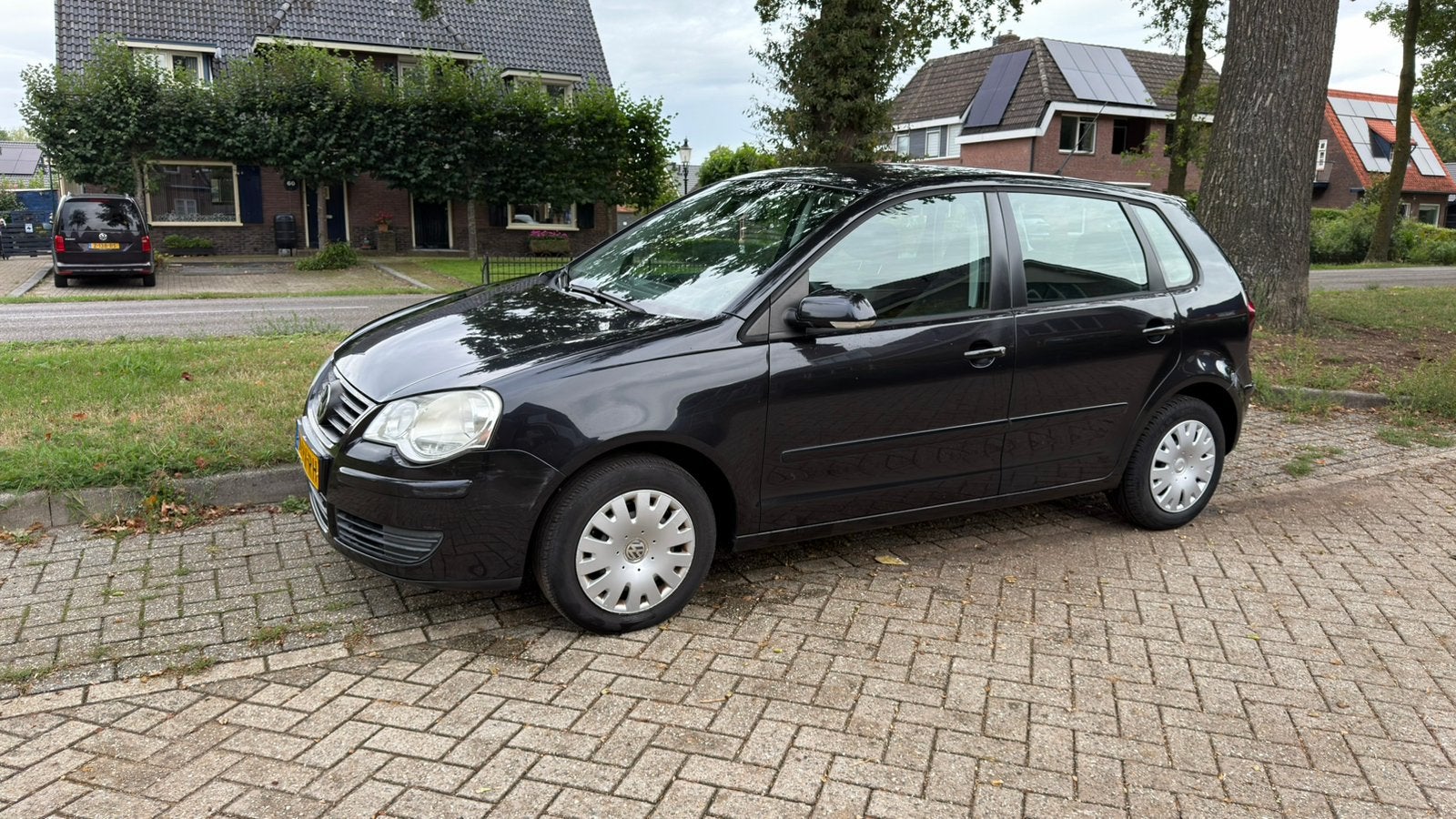 Volkswagen Polo 1.4 55KW 2005 Zwart, Auto's, Voorwielaandrijving, 15 km/l, Zwart, Origineel Nederlands